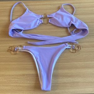 Purple bikini with adjustable straps and chain detail. Size S. Very cheeky/thong